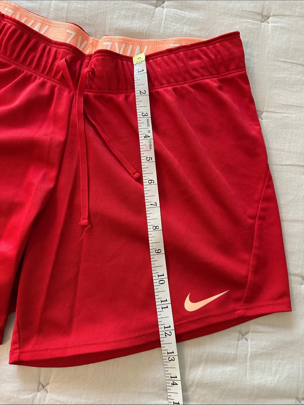 Nike Red Women's Athletic Running Shorts with peach Swoosh